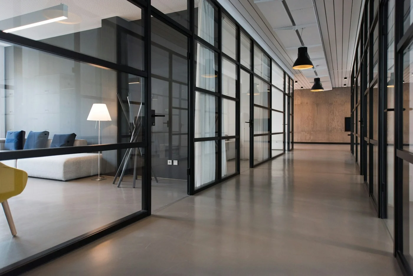 Glass-walled workspace with warm natural light